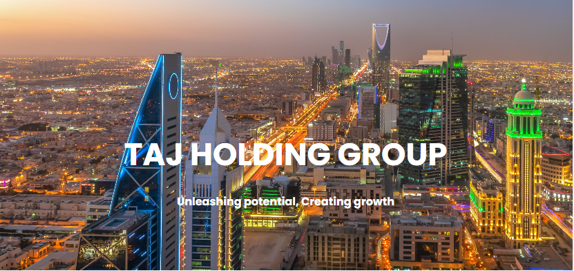 A business professional analyzing digital transformation strategies on a tablet, representing Taj Holding Group’s technology-driven growth